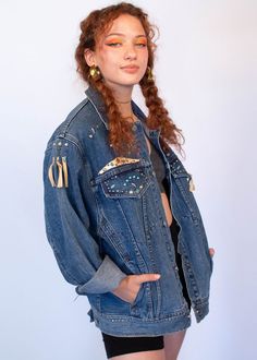 "Vintage 80s denim jacket. The ultimate classic 80s denim jacket is full of fun studded Southwestern jewels. Boxy oversized silhouette. Long sleeves. Bust and waist pockets. Front button fastening. Unlined. We kindly ask that you please view all measurements for comparison so you can get your desired fit. * Brand: Freeco Western * Decade: 1980s * Fabric: 100% Cotton * Lining: Unlined * Color: Medium Denim Wash C O N D I T I O N * Excellent vintage condition * Minimal pre-wear * No visible flaws Streetwear Denim Jacket With Rivets, Denim Blue Jacket For Fall Festival, Trendy Denim Jacket With Pockets For Festivals, Trendy Festival Denim Jacket In Medium Wash, Trendy Medium Wash Denim Jacket For Festivals, Fall Festival Denim Jacket With Pockets, Winter Festival Medium Wash Denim Jacket, Festival Denim Jacket With Pockets In Medium Wash, Festival Medium Wash Denim Jacket With Pockets