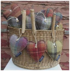 a basket filled with hearts sitting on top of a table