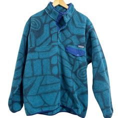 Patagonia Synchilla Snap T Fleece Pullover Aztec Stone The Pullover That Made Fleece Famous, Every Style Features Fleece Fabric Made Of 100% Recycled Polyester And Is Fair Trade Certified M Sewn.. Warm And Durable, The Synchilla Recycled Polyester Pullover Is What Made Fleece Famous. Classic Pullover Snap-T Styling Includes A Four-Snap Recycled Nylon Front Placket For Easy Venting And A Stand-Up Collar For Soft Warmth On Your Skin. Relaxed Fit Left-Chest Patch Pocket Holds The Day's Essentials: Aztec Stone, Patagonia Synchilla, Fleece Fabric, Teal Blue, Fair Trade, Patagonia, Snap Closure, Patch Pocket, Stand Up