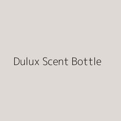 the words dulux scent bottle are shown in black on a gray background with an image of