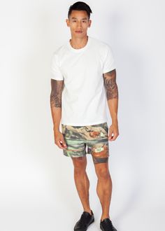 Stride in style and comfort with the men's Everlast x Coney Watercolor Nylon Shorts. Boasting a drawstring waistline for personalized comfort and side pockets for added convenience, these shorts fuse fashion with functionality. Featuring a standard fit and screen-printed graphics, they exude urban flair while offering practicality. The iconic Everlast logo at the hem adds a signature touch to complete the look, making them a must-have addition to your wardrobe. - *NOT ELIGIBLE FOR DISCOUNT OR PROMOTION- Model is 5'9 wearing a size medium Screen printed graphics 5.5" inseam Pockets on both sides Drawstring Return Policy Shipping Policy Sporty Cargo Shorts For Streetwear In Summer, White Casual Athletic Shorts For Outdoor, Khaki Athleisure Shorts For Summer, Sporty Khaki Shorts For Summer, Summer Athleisure Khaki Shorts, Sporty Khaki Shorts With Relaxed Fit, Casual Cargo Shorts For Summer Sports, Casual Summer Cargo Shorts For Sports, Green Cargo Shorts For Streetwear In Summer