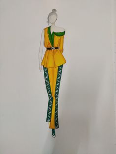 a mannequin is dressed in yellow and green