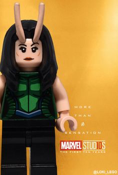 the lego character is wearing a green vest and black hair with horns on it's head