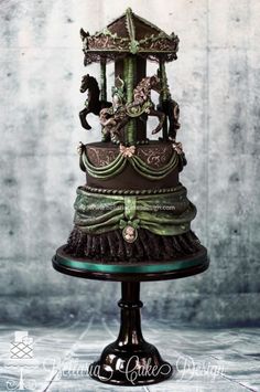 a three tiered cake with horses on it's top and green icing