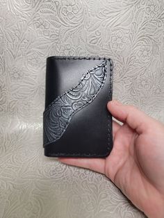 These beautiful handmade leather wallets are unique pieces that can add style to your purse or pocket.  The bifold wallets have 4 card pockets and 2 inside pockets, great for cards, receipts, or cash. Approximately 3 ¾ x 4 ¾ x ½ inch thick.  Thickness will vary slightly as each one is cut independently and leather thickness varies. Thank you for considering purchasing with our small business.  We make each item with care because we love what we do.  As with all leather, colors may vary slightly and there may be unique marks due to branding and animal scars. We try to avoid these but occasionally they are used as they make a piece unique.  If you have any questions or specific requests, please reach out.  We are always trying to expand with new ideas.  Other handmade leather items will be a Black Bifold Coin Purse With Card Slots, Custom Handmade Rectangular Trifold Wallet, Custom Handmade Trifold Wallet, Custom Rectangular Trifold Wallet With Coin Pocket, Black Leather Wallet As Gift, Black Leather Wallet Hand-stitched, Black Hand Tooled Bifold Wallet, Black Wallets With Interior Card Slots For Personal Use, Hand-stitched Black Leather Wallet