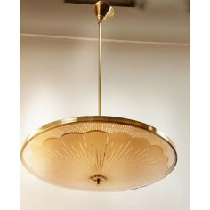 a light fixture hanging from the ceiling in a room