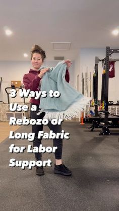 a woman standing in a gym holding up a blue blanket with the words 3 ways to use a rebozo off long fabric for labor support