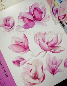 pink and white flowers are being painted on paper