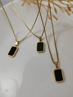 Adorn yourself with modern elegance through our Stainless Steel Necklace featuring a striking Black Agate Square Pendant. The sleek design seamlessly marries contemporary style with timeless allure. Crafted with precision, the stainless steel chain ensures durability, while the mesmerizing black agate stone pendant adds a touch of sophistication. Versatile and chic, this necklace effortlessly transitions from casual outings to special occasions, making it a wardrobe essential. Elevate your look Black Stone Pendant, Black Stone Necklace, Black Agate Stone, Square Pendant, Stone Pendant Necklace, Black Agate, Steel Necklace, Modern Chic, Black Stone