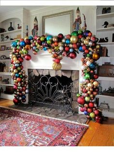 a fireplace decorated with ornaments and hanging from the mantle