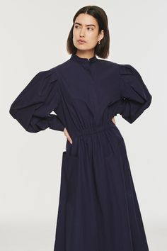 Meet Esme, a lightweight cotton poplin dress that'll carry you through the changing seasons. Finished in a versatile navy colour, it's a piece that can be dressed up or down depending on your mood. The design features an elasticated waist and slightly higher neckline for a flattering fit. Navy Cord Dress, Burgundy Dress Cotton Poplin, Dark Blue Wedding, Leather Shirt Dress, Cotton Poplin Dress, Navy Colour, Autumn Winter Collection, Blue Wedding Dresses, Denim Outerwear