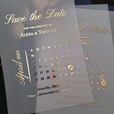 two wedding save the dates cards with gold foil on them, sitting next to each other