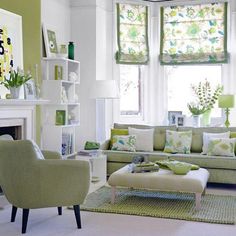 a living room with green and white decor