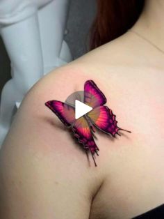 a woman's breast with a pink butterfly tattoo on her left shoulder and an arrow in the center