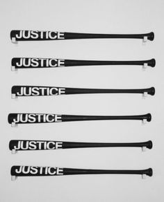 five black baseball bats with the words justice, justice, justice and justice written on them