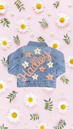 Custom hand embroidered denim jacket.  When purchase comment with name and colors you would like. Can do flowers, sun, rainbow, bee, clouds, if there's a design you would like you can message me. Customizable Denim Outerwear For Spring, Customizable Cute Cotton Outerwear, Cute Customizable Cotton Outerwear, Customizable Denim Jacket For Spring, Spring Customizable Denim Jacket, Cute Cotton Denim Jacket, Customizable Blue Denim Jacket For Spring, Customizable Spring Denim Jacket, Customizable Trendy Denim Jacket For Spring