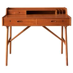 a wooden desk with two drawers on one side and an open drawer on the other