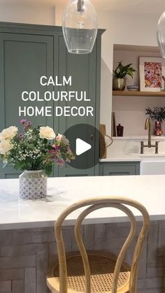 a kitchen with green cabinets and white countertops is featured in the video called calm colorful home decor