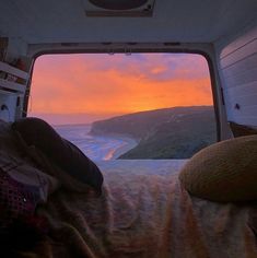 the view from inside an rv looking out at the ocean