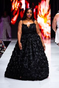 Plus size model walking the runway in a plus size black wedding gown with textured rose skirt. Models On The Runway, Plus Size Wedding Gown, Fall Wedding Gowns, Gothic Gowns, Pink Wedding Gowns, Black Wedding Gowns, Plus Size Brides, Tulle Wedding Gown, Gothic Wedding Dress