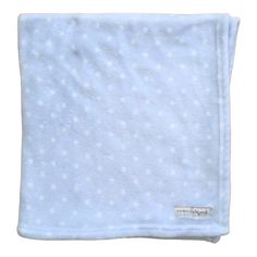 a blue blanket with white polka dots on it