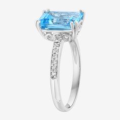 Ring Style: Cocktail RingsFeatures: Quick ShipDiamond Clarity: I1-I2Setting: ProngStone Cut: EmeraldDiamond Color: H-IMetal Color: WhiteRing Gallery Height: 6.5mmRounded Carat Weight: 1/10 Ct. T.w.Care: Wipe CleanStone Type: 1 Genuine Blue Topaz, 12 Natural DiamondAuthenticity: Genuine StoneBirthstone: December BirthstoneMetal: Sterling SilverCountry of Origin: Imported Emerald Cut Blue Topaz Ring In White Gold, White Gold Emerald Cut Topaz Ring, Sapphire Rings With Diamond Accents And Blue Topaz, Sapphire Colored Blue Topaz Rings With Diamond Accents, Emerald Cut Topaz Birthstone Rings, Blue Topaz Ring With Diamond Accents For Promise, Blue Topaz Promise Ring With Diamond Accents, Emerald Cut Topaz Ring With Diamond Accents For Promise, Fine Jewelry Blue Topaz Birthstone Ring With Diamond Accents