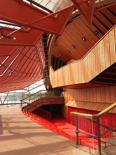 the inside of a building with red carpet and stairs