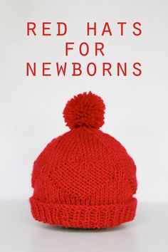 a red knitted hat with the words red hats for newborns written on it