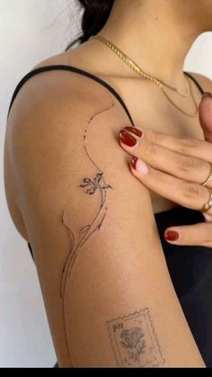 a woman's arm with a tattoo on it