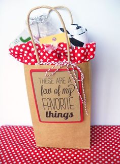 a brown paper bag with red and white polka dots on it that says, these are a few of my favorite things