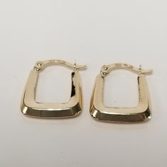 "Thanks for shopping our vintage estate store. We tend to sell well below wholesale and truly hope you enjoy all of our items. Many of the items are one of a kind, so please enjoy scrolling through the pictures and hopefully something will catch your eye. Brown spots are from reflections. Beautiful estate 10k yellow gold small hoops square cut design. Length: 5/8\" Width: 1/2\" Thickness: 2.5mm 1/8\" Weight: .44 gram Nice earrings and some you will love. Did not see any dings on the hoops. Marked 10k." Vintage 14k Stamped Earrings For Formal Occasions, Rectangular Hoop Earrings For Formal Events, Formal Rectangular Hoop Earrings, Vintage Yellow Gold Hoop Earrings For Formal Occasions, Vintage 14k Gold Silver Earrings, Formal Earrings With Lever Back And Rectangular Shape, Vintage Small Hoop Gold Earrings, Classic Rectangular Hoop Earrings For Anniversary, Classic Rectangular Earrings For Anniversary