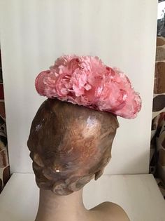 "Vintage 1950's 1960's Petite and Sweet Pink floral hat. The label is *Miss Sally Victor* New York. To keep hat on your head, you would need to use a hatpin (Not Included). *MORE INFORMATION BELOW* CONDITION: No issues noted. MEASURES: Inside circumference-16\" Front to back-6\" Left to right-6\" *WE APOLOGIZE~BUT WE NO LONGER SHIP TO GERMANY, ITALY OR SPAIN. IF ORDERS COME IN FROM GERMANY, ITALY OR SPAIN, WE WILL HAVE TO CANCEL THEM AND REFUND YOUR MONEY. SORRY FOR THIS INCONVENIENCE*" Vintage Headband For Kentucky Derby, Vintage Costume Hats For Spring Party, Vintage Costume Hats And Headpieces For Spring Party, Spring Vintage Costume Hats And Headpieces For Party, Vintage Hats For Church At Royal Ascot, Handmade Vintage Costume Hats For Kentucky Derby, Vintage Mini Hat Headband For Vintage Events, Vintage Spring Party Costume Hats And Headpieces, Vintage Fitted Headpiece For Kentucky Derby