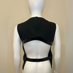 This Stunning Black Backless Top From Tom Ford's Gucci Collection Is A Must-Have For Any Fashion-Forward Woman. The Sleek Tank Design Features A Backless Design And Is Made From High-Quality Materials That Will Last For Years To Come. Perfect For A Night Out Or A Special Occasion, This Top Is Sure To Turn Heads With Its Unique Design And Stunning Backless Feature. Available In Size M, This Top Is Perfect For Women Of All Shapes And Sizes. So Why Wait? Add This Beautiful Tom Ford For Gucci Top To Your Wardrobe Today And Elevate Your Style To The Next Level. Measurements Shoulders: 13” Bust: 34” Waist: 27” Black Backless Top, Tom Ford For Gucci, Tom Ford Gucci, Gucci Collection, Tailored Fashion, Gucci Top, Tank Design, Backless Top, Backless Design