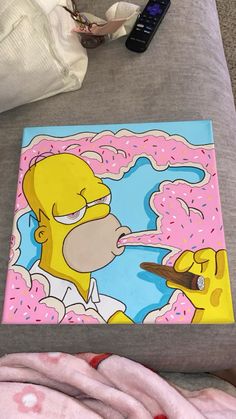 the simpsons painting is being displayed on the bed