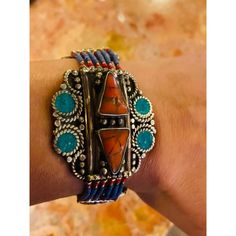 This beautiful, one-of-a-kind handmade bracelet, crafted around the 1920s by the Berber tribes in Morocco, features genuine turquoise stones along with other natural stones in red, blue, and orange. All are shaped into impressive geometrical patterns that reflect the rich culture of Morocco. The bracelet has been cleaned and is in great condition.  Size: 7.5" L x 1.75" W Traditional Adjustable Beaded Bracelets With Natural Stones, Handmade Southwestern Healing Bracelets, Spiritual Gemstone Bracelets For Festivals, Bohemian Multi-stone Adjustable Bracelets, Bohemian Adjustable Multi-stone Bracelets, Traditional Turquoise Hand Wrapped Jewelry, Handmade Bohemian Ceremonial Bracelets, Traditional Turquoise Hand-wrapped Jewelry, Artisan Jewelry With Natural Stones For Ceremonial Use