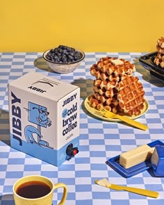 a box of blueberry waffles sitting on top of a checkered table