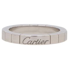 A stylish vintage Cartier Lanières ring set in 18k white gold. The ring is composed in the iconic Cartier Lanières brick link design. Uniquely, to the opposite side of the band is the Cartier signature, which gives the wearer the option to wear the ring diamond side up or signature side up. Due to the design and style this ring could be worn for a variety of occasions. The versatility to change the style of the ring means the ring could be worn for everyday and then dressed up for more special events. The ring is currently a Cartier finger size 50 (which converts to a UK finger size K, USA finger size 5 1/4), Due to the design this cannot be resized. For size reference the width of the bad is 0.3 centimetres and there is a gross weight of 6.1 grams. The ring is signed and hallmarked Cartie Mens Cartier, Cartier Band, Cartier White Gold, Contemporary Engagement Rings, Vintage Cocktail Ring, Link Design, Diamond Cocktail Rings, Diamond Ring Settings, Modern Ring