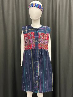 "This beautiful handmade dress reflects Guatemala's cultures through its vibrants colors and patterns. It has straps on the back for an adjustable fit. The dress has patchwork from different cities in Guatemala such as: Solola, Huhuetenango, Quiche and Sacatepequez. Size runs small. I would suggest to get one to two sizes bigger. Measurements: Armpit to armpit: 16\" Collar to bottom: 27\" Caring Instructions; - Wash separate with cold water - Air Dry or Lay Flat" Multicolor Woven Motifs Dresses For Festivals, Multicolor Dresses With Woven Motifs For Festivals, Fitted Multicolor Dress With Woven Motifs, Festive Multicolor Dresses With Woven Motifs, Festive Multicolor Dress With Woven Motifs, Traditional Cotton Festival Dresses, Cotton Dresses With Traditional Patterns For Festival, Cotton Dresses With Traditional Embroidered Patterns, Cotton Dresses With Multicolor Embroidery And Traditional Patterns