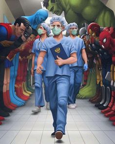 a man in scrubs walking down a hallway with other men wearing masks and surgical garb