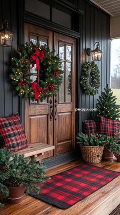 two christmas wreaths on the front porch with pine cones and evergreen trees in pots