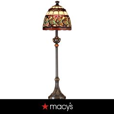 a lamp that is sitting on top of a table next to a white background with the words macy's written below it