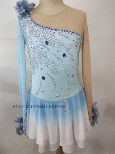 a blue and white dress with sequins on it