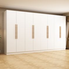 an empty room with white cabinets and wood flooring is pictured in this image, there are no people or objects on the wall