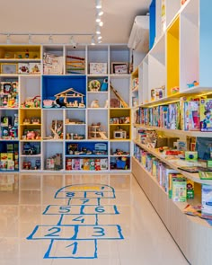 the children's store is filled with toys and bookshelves that are brightly colored