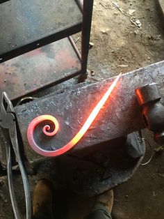 a person is working on an object with red light