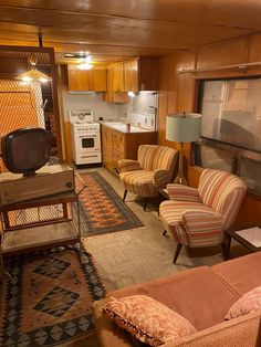 a living room filled with furniture and a flat screen tv