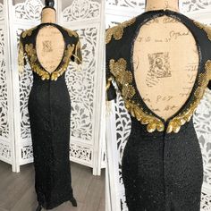 Vintage silk lined dressMade by MonikaSize 6Length: 46.5" from armpit downChest: 36"Waist: 27"Hips: 34-38"Color: black, goldShell 100%  silkLining 100% PolyesterMade in IndiaGood vintage condition. It has some missing beads but hard to noticeable.Please expect some normal wear due to age. Please look at all photos: lighting is different on all computers. Ask all questions before buying. Embellished Fitted Sequin V-neck Dress, Fitted Sequined Evening Dress With Short Sleeves, Fitted V-neck Embellished Sequin Dress, Fitted Sequin Dress With Short Sleeves For Wedding, Festive Fitted V-neck Evening Dress, Beaded Fitted Dress For Night Out, Fitted Beaded Dress For Night Out, Fitted Floor-length Beaded Dress, Holiday Embellished Fitted Evening Dress