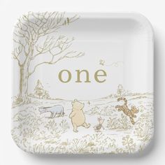 a white plate with winnie the pooh and tigger on it that says, one