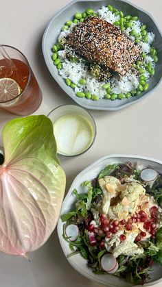 three plates of food on a table with drinks