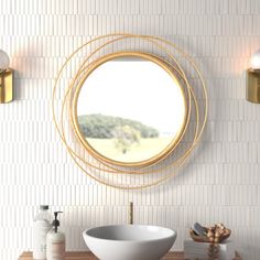 a bathroom with a sink, mirror and soap dispenser on the wall